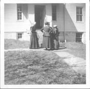 SA1708.45 - Four women outside a building talking with one another., Winterthur Shaker Photograph and Post Card Collection 1851 to 1921c